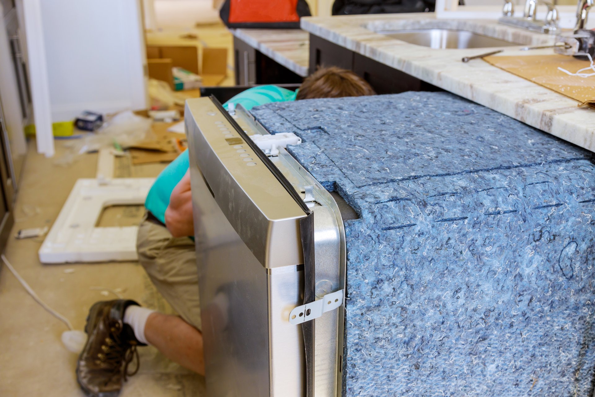 Person looking disappointed at dirty dishes from dishwasher